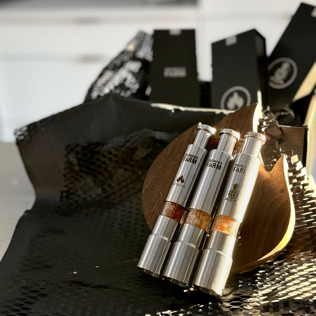 Trifecta Pushers and walnut flame holder in their packaging